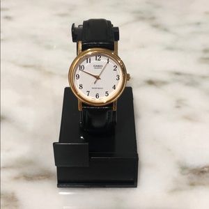 Vintage Casio watch with black leather strap